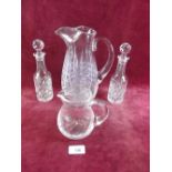 Two cut glass jugs and a pair of vinaigrette bottles