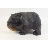 A Black Forest carved bear with fish - 15cm tall