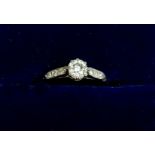 A small sized white gold ring set diamond on diamond set shoulders, unmarked, size G