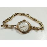 An Everite gold ladies wrist watch with octagonal face