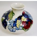 A Moorcroft squat vase in a floral design - 8cm