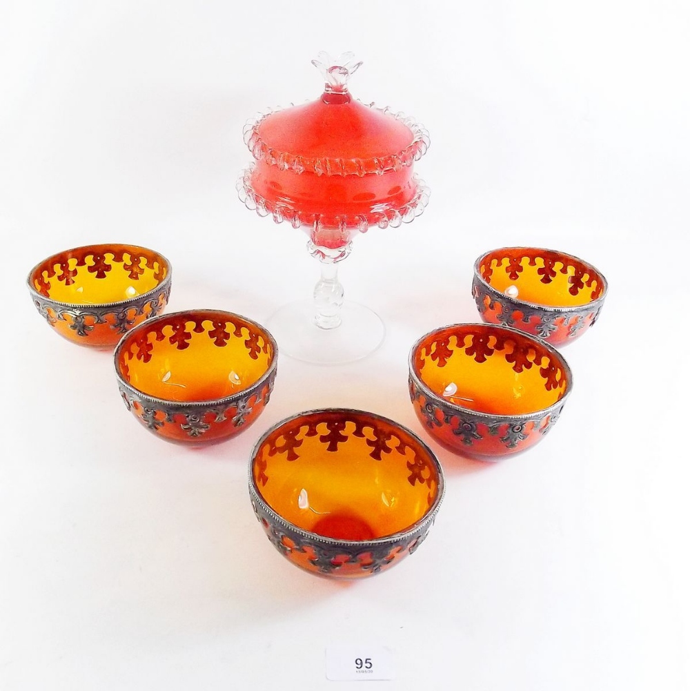 Five orange glass bowls with pewter mounts and an orange studio glass bowl and cover