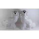 A pair of large Victorian Staffordshire dogs with glass eyes - 32cm