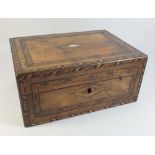 A Victorian walnut work box with mother of pearl and marquetry decoration