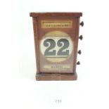 A Victorian mahogany desk calendar 19.5cm tall