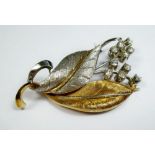 An 18 carat white and yellow leaf brooch set spray of ten diamonds - 12g