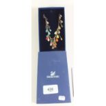 A Swarovski crystal and coloured enamel necklace - boxed