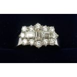 An 18 carat white gold ring set baguette and brilliant cut diamonds in Art Deco style - size Q