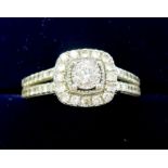 A 9 carat white gold Art Deco style square cluster ring on twin diamond set shoulders - size L 1/2 -