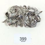 A good quality silver Art Nouveau style nurses buckle in the form of scrolling flowers