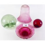 A small Victorian cranberry etched glass shade, a cranberry dish, a dump weight and a red