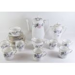 A Royal Worcester 'June Garland' coffee set comprising: seven cups and saucers, five tea plates,