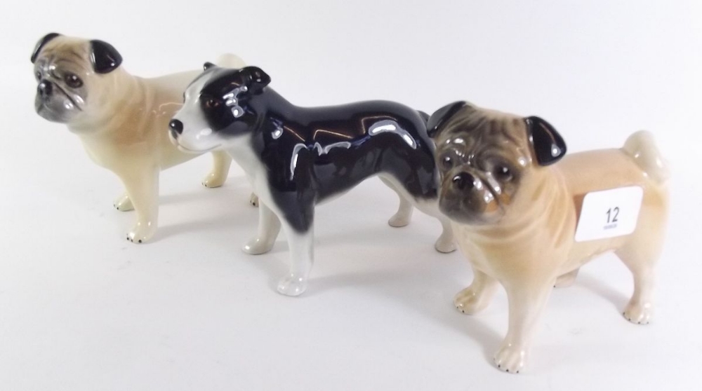 Two pottery pug dogs and a Staffordshire terrier