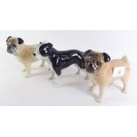 Two pottery pug dogs and a Staffordshire terrier
