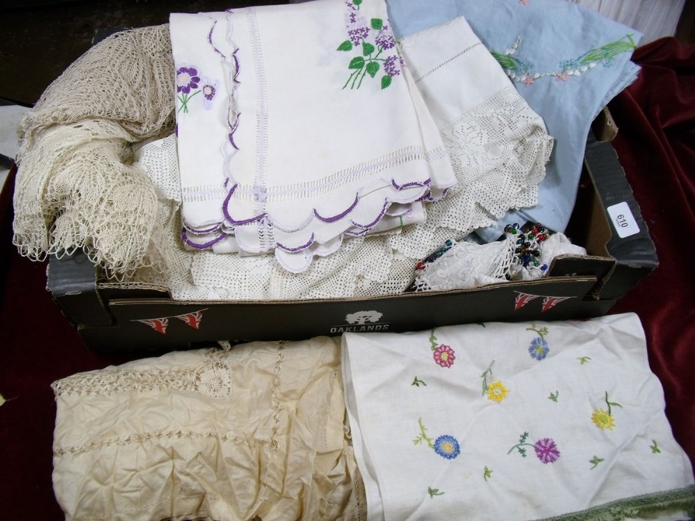 A box of machine made lace table cloths, embroidered table linen etc