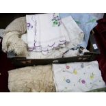 A box of machine made lace table cloths, embroidered table linen etc