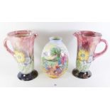 A Crown Ducal vase printed garden scene and a pair of Kensington Ware large jugs printed flowers