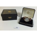 An Accurist GMT 004 Greenwich Commemorative gentlemans wrist watch with leather strap in original