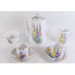 A 1930's Royal Albert Crown China coffee set painted floral pattern consisting of coffee pot, six