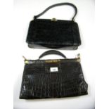 An early 20th century black crocodile skin handbag and a vintage handbag