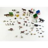 A Britain's lead farm including three carts, figures, cows and horses etc