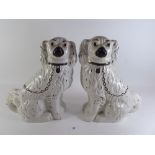 A pair of Staffordshire style dogs - 29cm tall.