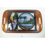 A marquetry Rio de Janeiro two handled tray with butterfly wing landscape and parrot decoration