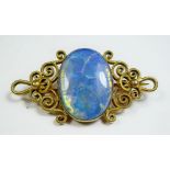 An 18 carat gold brooch set opal 9g - opal a/f - 4.5cm across