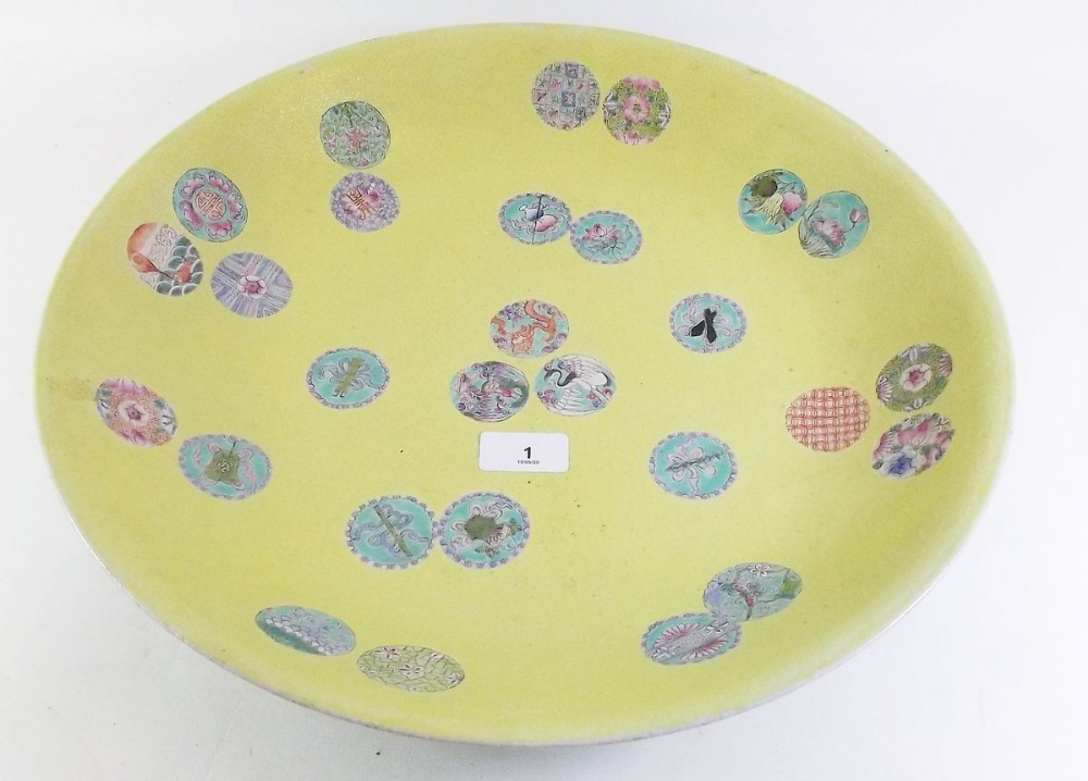 A large Chinese yellow porcelain charger painted scattered symbols - 40cm diameter