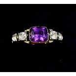 An antique paste ring set amethyst, unmarked but tests as gold, circa 1850, size O