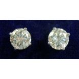 A pair of large platinum set diamond stud earring (total 2.35 carats)