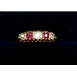 An Edwardian 18 carat gold ruby and diamond ring - size H