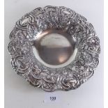 An Edwardian silver embossed dish by Walker & Hall Sheffield 360g, Sheffield 1902, 23cm