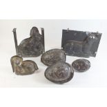 A group of Victorian lead and zinc chocolate moulds including sheep, rabbit, eggs etc