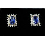 A pair of sapphire and diamond earrings - overall size 7mm x 9mm