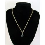 A 9 carat gold blue topaz pendant on 9 cart gold spiral link chain - 4g