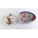 A Queen Victoria porcelain trio for 1887 with painted coat of arms and a Japanese Imari bowl