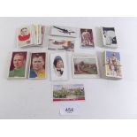 A collection of loose cigarette cards by Godfrey Phillips Ltd. Subjects include Soldiers of the