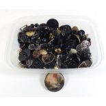 A box of various vintage buttons including one with painted landscape