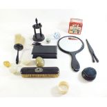 An ebony dressing table set, various stone eggs etc