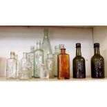 A collection of glass medicine/chemist bottles and jars