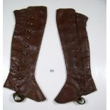 A fur cape and a pair of ladies leather gaiters