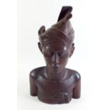A carved Indonesian bust of a woman - 33cm