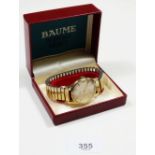 A Baume gold gentleman's wrist watch - boxed
