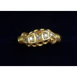 An 18 carat gold five stone diamond ring, size O, 2.2g