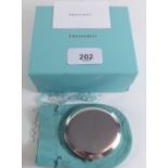 A Tiffany and Co silver compact - boxed, with bag etc