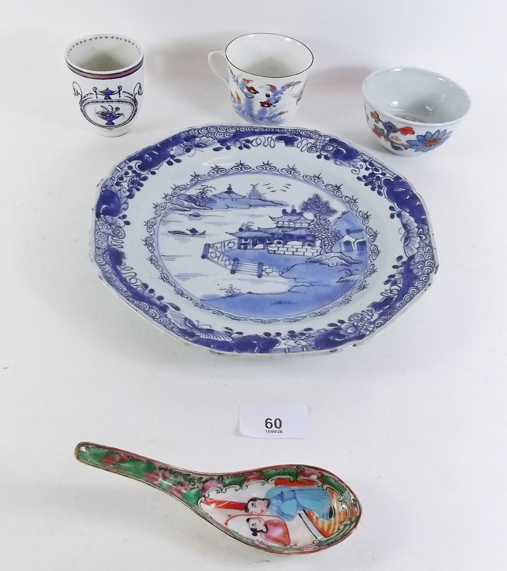 An 18th century Chinese blue and white plate painted landscape, three cups and a spoon