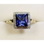 A 9 carat gold sapphire and diamond cluster ring - size V