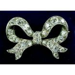 A Victorian silver and diamond set bow from brooch, total weight 5g, 3cm x 2cm