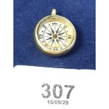 An 18 carat gold framed compass charm 0 8g a/f